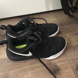 Black Nike gym shoes/volleyball shoes.